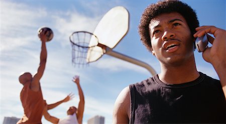simsearch:700-00060777,k - Basketball Player Uses Cell Phone Stock Photo - Rights-Managed, Code: 700-00158063