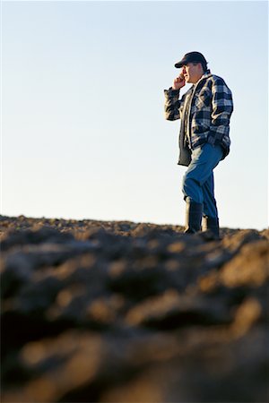 farm phone - Farmer in Field Using Cell Phone Stock Photo - Rights-Managed, Code: 700-00150874