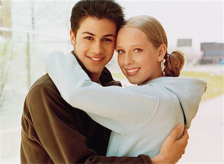 Teenage Couple Embracing Foto de stock - Con derechos protegidos, Código: 700-00152710