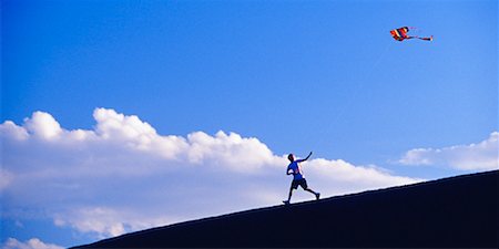 sky in kite alone pic - Boy Flying Kite Stock Photo - Rights-Managed, Code: 700-00153047