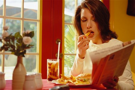 simsearch:6108-06166047,k - Woman Eating Fast Food Stock Photo - Rights-Managed, Code: 700-00165739