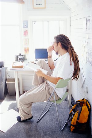 simsearch:700-00035269,k - Man Sitting in Home Office Stock Photo - Rights-Managed, Code: 700-00166255