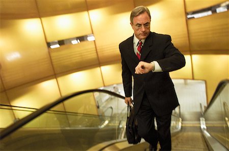 Businessman on Escalator Stock Photo - Rights-Managed, Code: 700-00166434