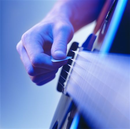picture of the blue playing a instruments - Close-Up of Hand Strumming Guitar Stock Photo - Rights-Managed, Code: 700-00168231