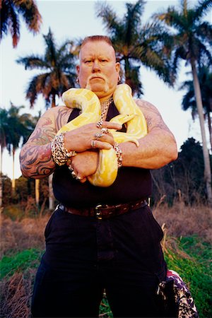 person holding snake - Portrait of Man Holding a Snake Stock Photo - Rights-Managed, Code: 700-00160560