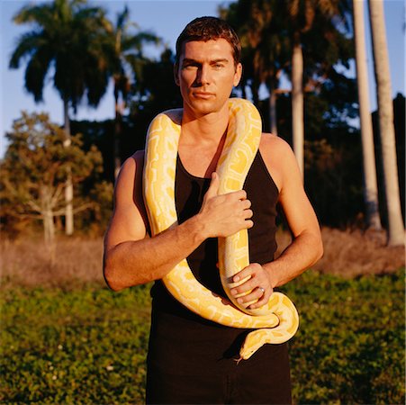 people holding snakes - Portrait of Man Holding a Snake Stock Photo - Rights-Managed, Code: 700-00160562