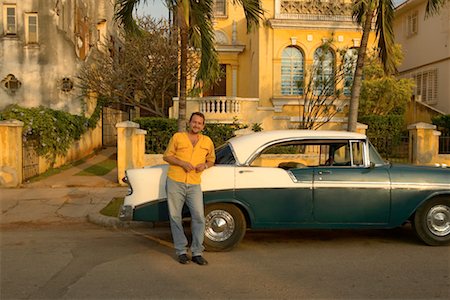 Man Leaning on Classic Car Havana, Cuba Stock Photo - Rights-Managed, Code: 700-00160777