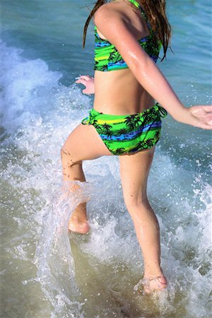 Girl Running through Waves Stock Photo - Rights-Managed, Code: 700-00161717