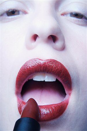 simsearch:700-00606512,k - Close-Up of Woman Putting Lipstick on Stock Photo - Rights-Managed, Code: 700-00177985