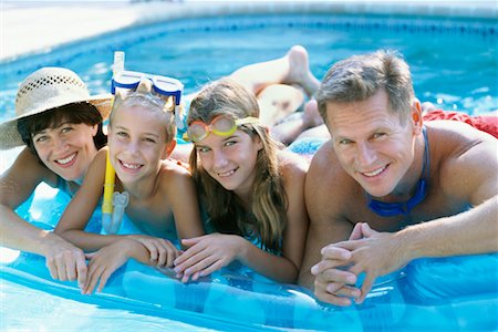 simsearch:400-05309800,k - Family in Swimming Pool Stock Photo - Rights-Managed, Code: 700-00178454