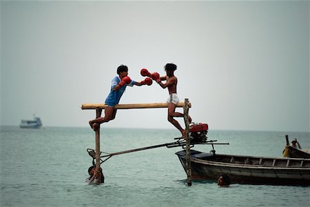 simsearch:700-00031108,k - Boys Boxing on Balance Beam Phi Phi National Park Ao Phra Nang, Thailand Stock Photo - Rights-Managed, Code: 700-00189200