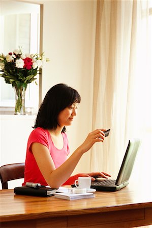 simsearch:700-00688680,k - Woman Holding Credit Card and Using Laptop Computer Stock Photo - Rights-Managed, Code: 700-00182638