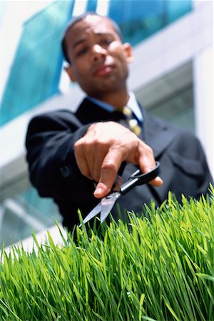 Businessman Trimming Grass Stock Photo - Rights-Managed, Code: 700-00183892