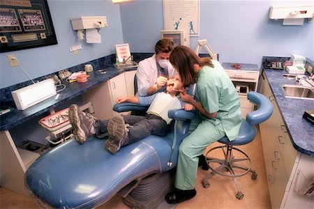 dentist with patient in exam room - Dentists Examining Girl Stock Photo - Rights-Managed, Code: 700-00194616