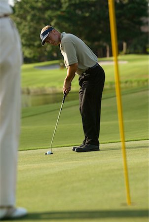 simsearch:6113-07159316,k - Golfer Putting Stock Photo - Rights-Managed, Code: 700-00195211