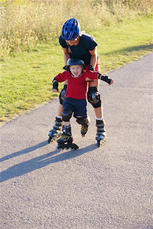 Mother Teaching Son to In-Line Skate Stock Photo - Rights-Managed, Code: 700-00196114