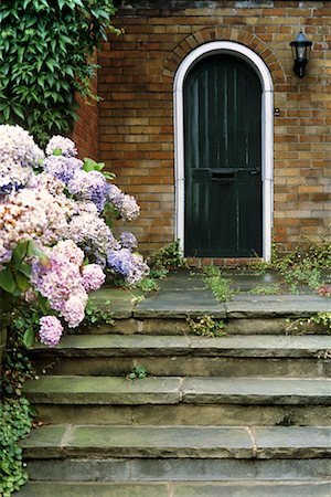 Door with Porch and Flowers Stock Photo - Rights-Managed, Code: 700-00196729