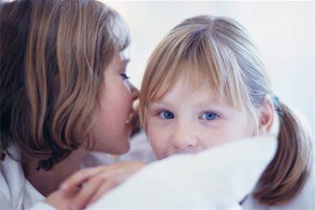 pictures of a little girl whispering - Girls Sharing Secret Stock Photo - Rights-Managed, Code: 700-00197075