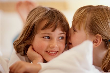 pictures of a little girl whispering - Girls Sharing Secret Stock Photo - Rights-Managed, Code: 700-00197076