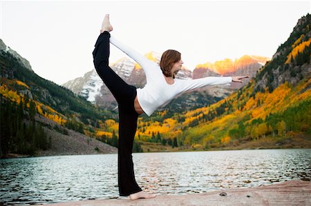 Woman Practicing Yoga Outdoors Foto de stock - Con derechos protegidos, Código: 700-00197491