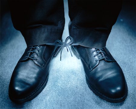 Man's Shoes with Laces Tied Together Stock Photo - Rights-Managed, Code: 700-00197697