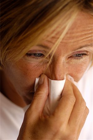 Woman Blowing Nose Stock Photo - Rights-Managed, Code: 700-00197970