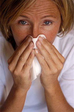 Woman Blowing Nose Stock Photo - Rights-Managed, Code: 700-00197971