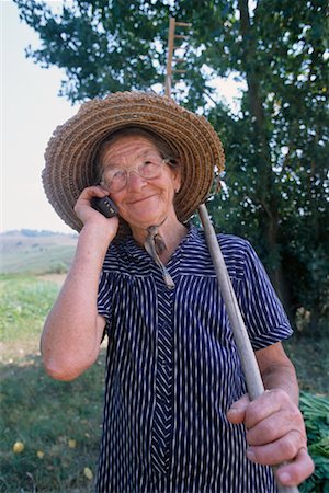 phone one person adult smile elderly - Woman Using Cell Phone Stock Photo - Rights-Managed, Code: 700-00198548