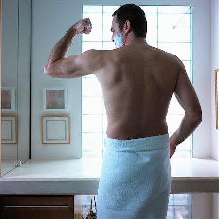 simsearch:700-00350110,k - Man Flexing in Bathroom Stock Photo - Rights-Managed, Code: 700-00199901