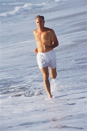 simsearch:400-04535435,k - Man Running on Beach Stock Photo - Rights-Managed, Code: 700-00190639