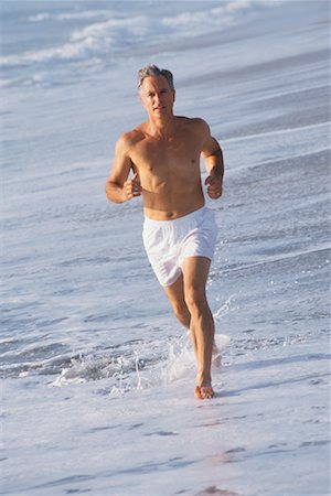 simsearch:400-04535435,k - Man Running on Beach Stock Photo - Rights-Managed, Code: 700-00190640