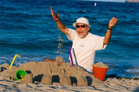 simsearch:700-00190697,k - Man Building Sandcastle Stock Photo - Rights-Managed, Code: 700-00190697