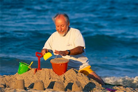 simsearch:700-00190697,k - Man Building Sandcastle Stock Photo - Rights-Managed, Code: 700-00190698