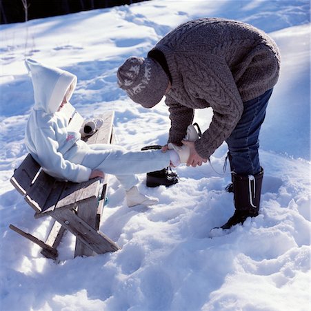 Father Helping Daughter with Skates Stock Photo - Rights-Managed, Code: 700-00268156