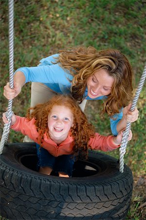 Mother with Daughter on Tire Swing Stock Photo - Rights-Managed, Code: 700-00269006