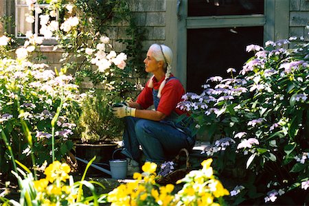 Woman Sitting in Garden Stock Photo - Rights-Managed, Code: 700-00263145