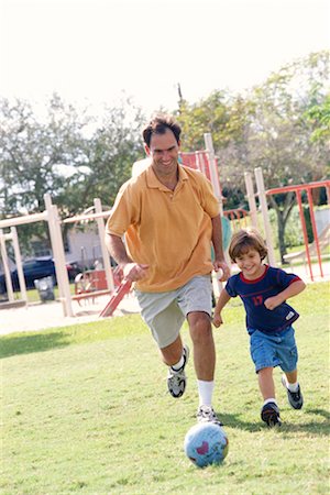 simsearch:700-00361698,k - Father and Son Playing Soccer Stock Photo - Rights-Managed, Code: 700-00275053