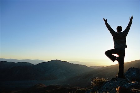 silhouette of man standing in a mountain top - Man Practicing Yoga Outdoors Stock Photo - Rights-Managed, Code: 700-00280579