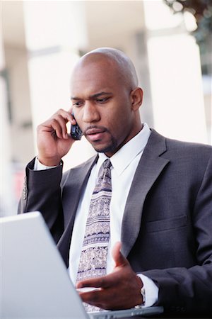 simsearch:700-00281308,k - Businessman with Laptop and Cell Phone Stock Photo - Rights-Managed, Code: 700-00281307