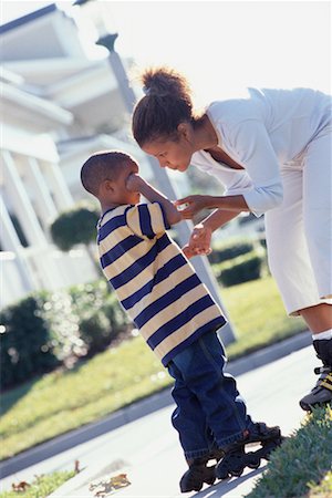 pre teen rollerblading - Mother In-Line Skating with Son Stock Photo - Rights-Managed, Code: 700-00281730