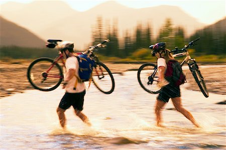 roy ooms - Couple Crossing River with Mountain Bikes Stock Photo - Rights-Managed, Code: 700-00281793