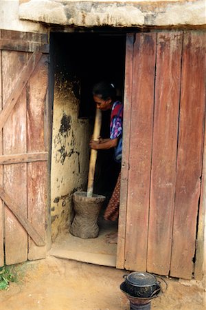 poor africans - Woman Pounding Grain Stock Photo - Rights-Managed, Code: 700-00328455