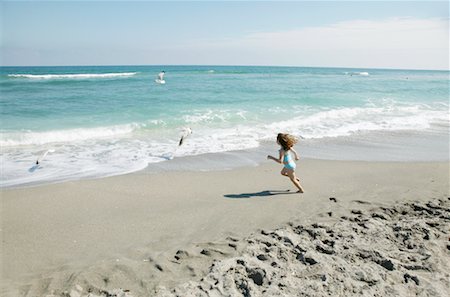 six year old girl running - Girl Running on Beach Stock Photo - Rights-Managed, Code: 700-00328547