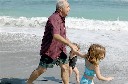 simsearch:700-00046927,k - Grandfather and Granddaughters On Beach Stock Photo - Rights-Managed, Code: 700-00328542