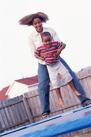 simsearch:700-00164794,k - Mother and Son Jumping on Trampoline Foto de stock - Con derechos protegidos, Código: 700-00345207