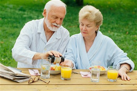 simsearch:6108-05867295,k - Couple Wearing Pyjamas, Sitting Outdoors and Taking Medication Stock Photo - Rights-Managed, Code: 700-00345615