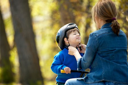 simsearch:700-03067843,k - Mother Fastening Son's Helmet Stock Photo - Rights-Managed, Code: 700-00345676