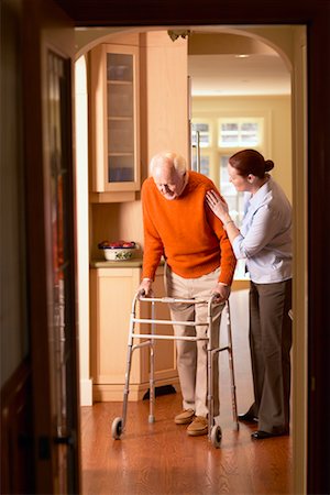 Woman Helping Man with Walker Stock Photo - Rights-Managed, Code: 700-00341064