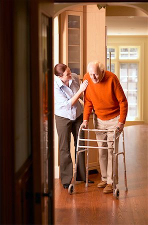 Woman Helping Man with Walker Stock Photo - Rights-Managed, Code: 700-00341065