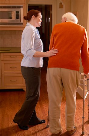 Woman Helping Man with Walker Stock Photo - Rights-Managed, Code: 700-00341066